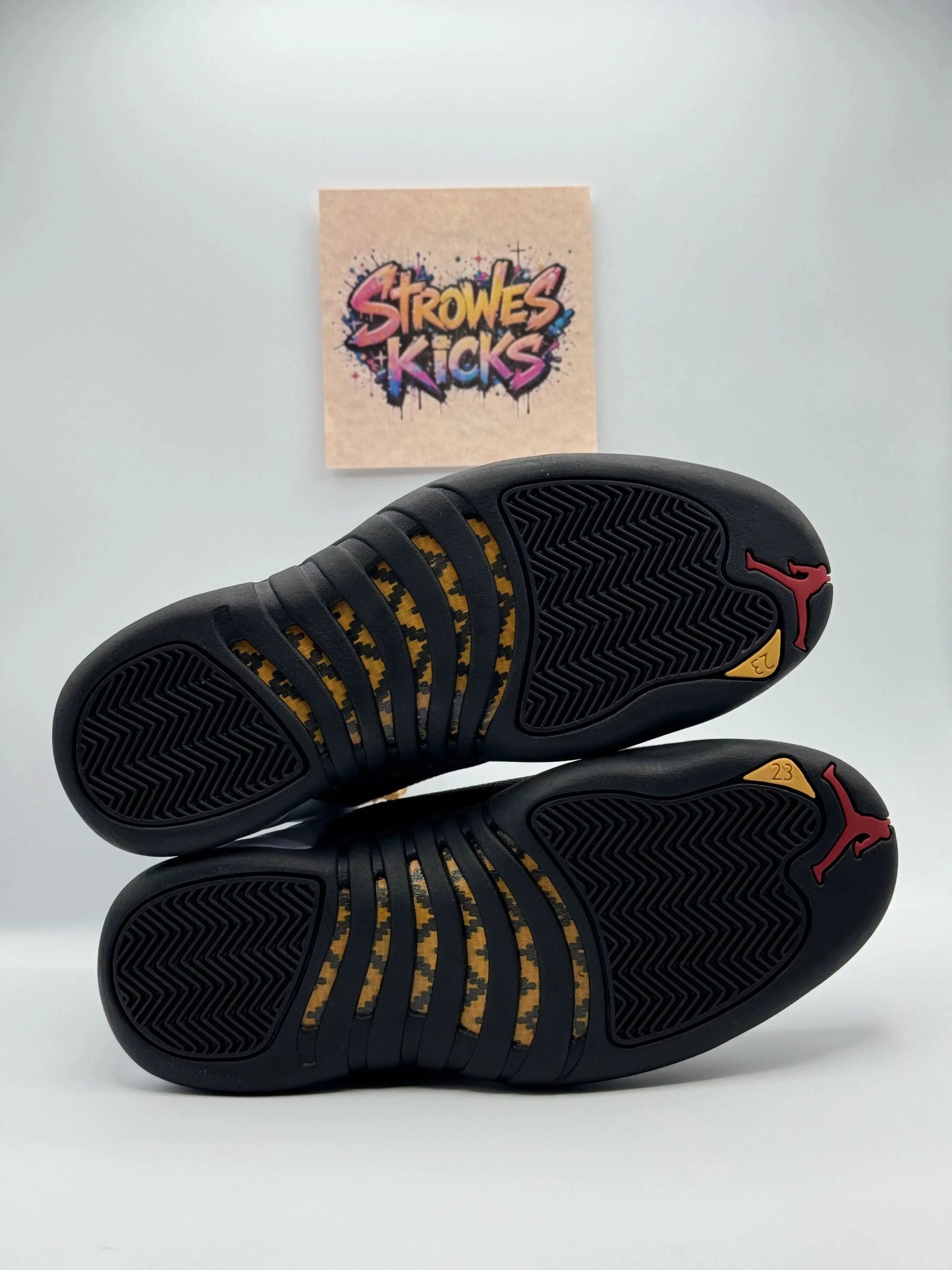 Jordan 12 “Taxi” Strowes Kicks